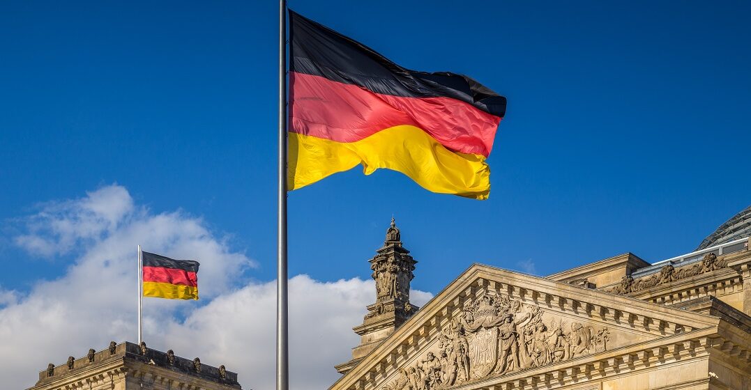 The German flag in front of the German Bundestag as a representation of the national anthem