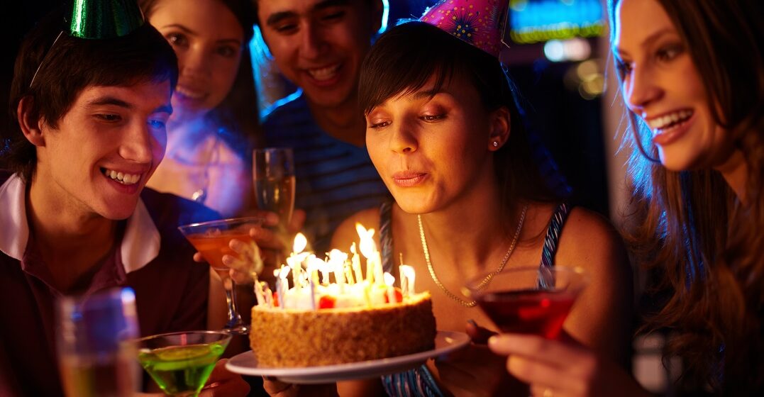 Portrait,Of,Charming,Girl,Blowing,On,Candles,On,Birthday,Cake