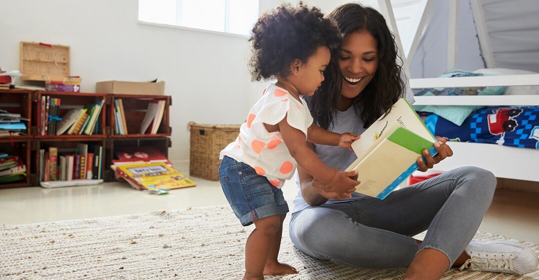 A mother and her child reading a book on Mother's Day in Switzerland