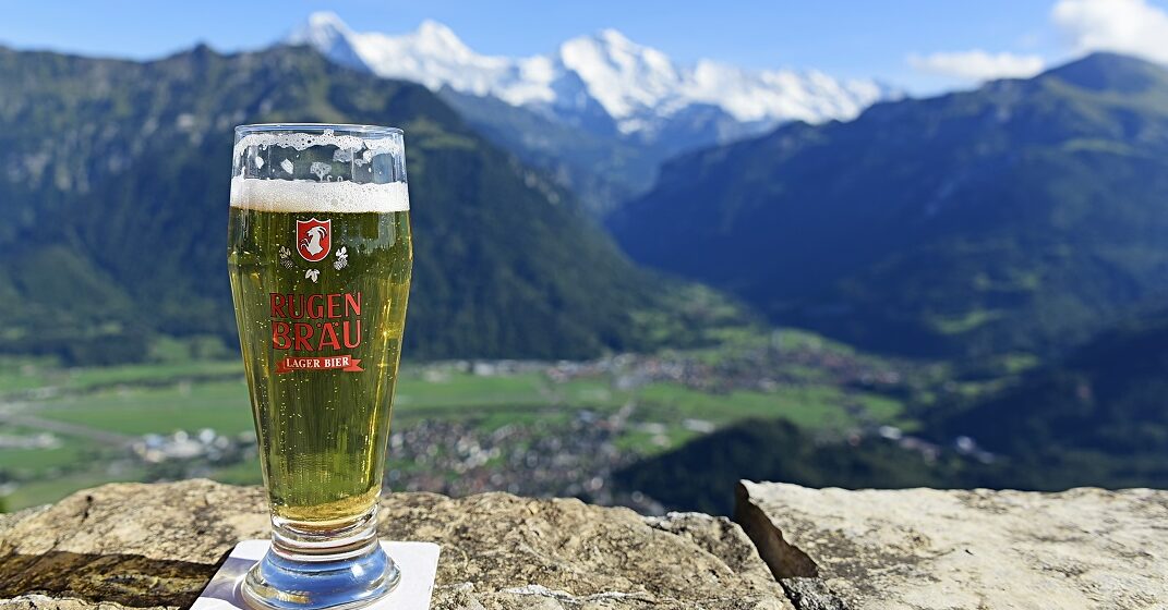 Swiss beer in front of a mountain background