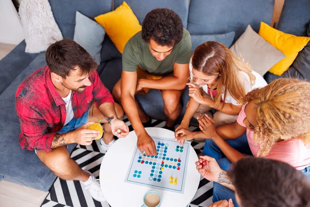 Friends playing German board games