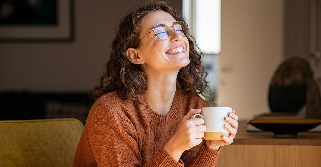 Portrait,Of,Joyful,Young,Woman,Enjoying,A,Cup,Of,Coffee