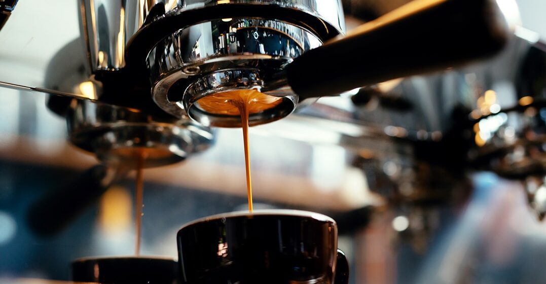 Close-up,Of,Espresso,Pouring,From,Coffee,Machine.,Professional,Coffee,Brewing
