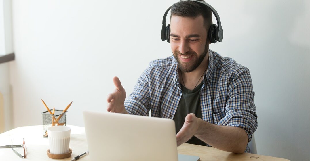 Male,Worker,In,Headphones,Talking,,Making,Video,Call,,Chatting,With