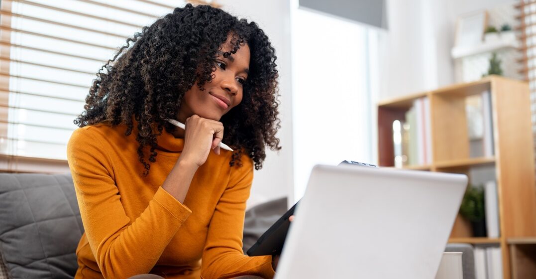 young African American girl on her laptop learning about the German deutsch punctuation