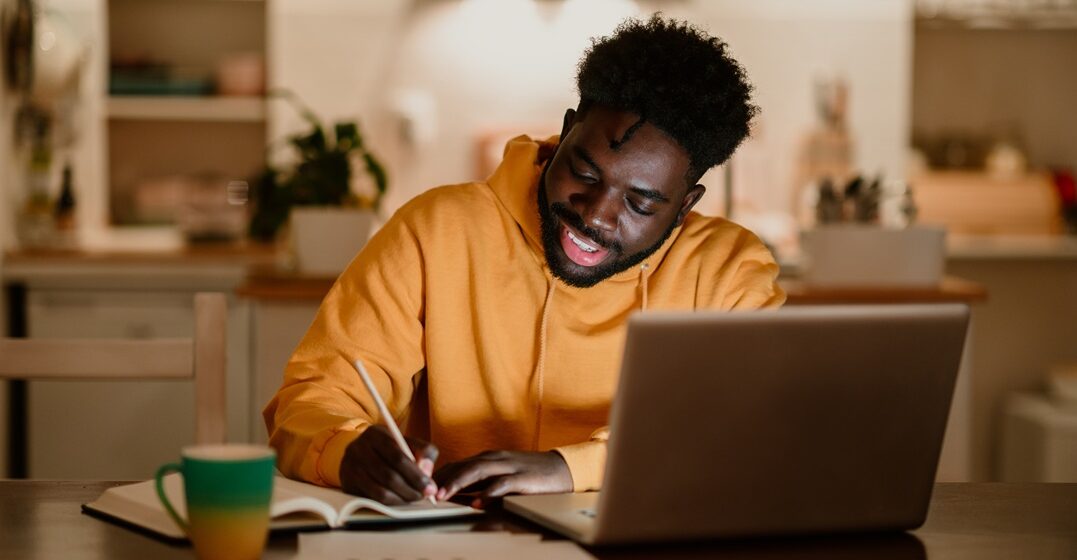 Young man learning how to use denn in german