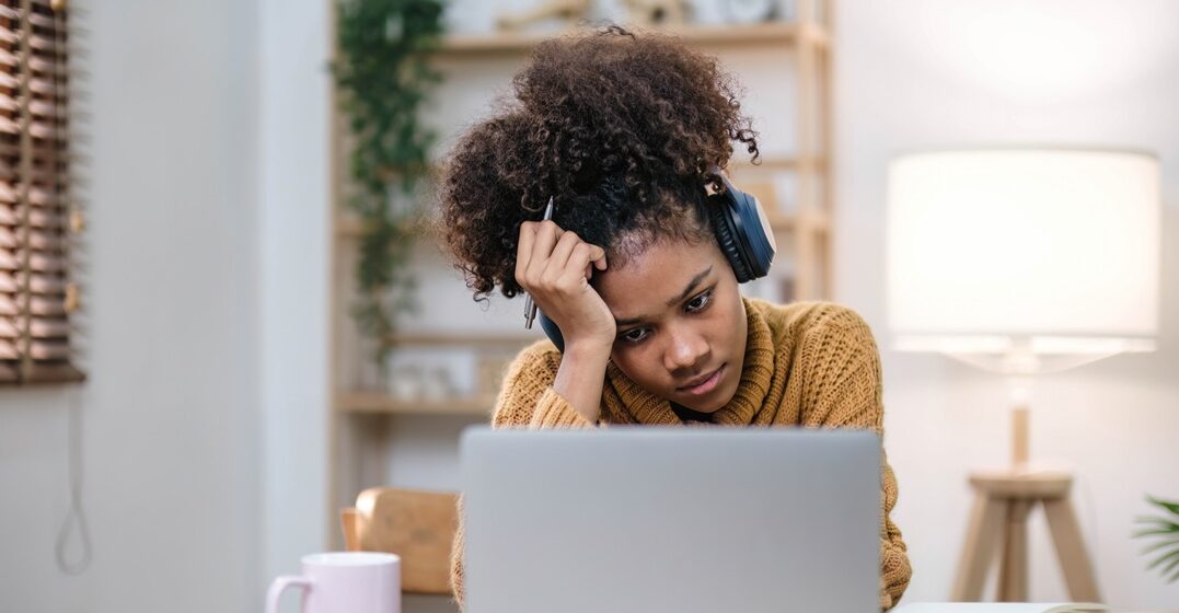 young afro american girl at her desktop learning from the German mistakes she made