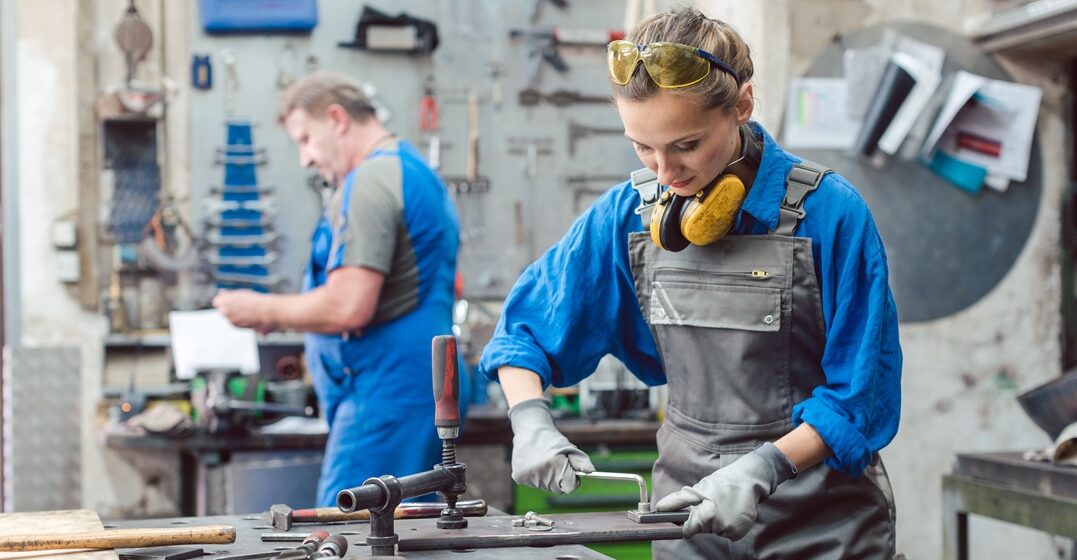 couple of man and woman working in an atelier representing the innovation and science among other German values