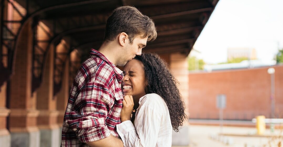 two young people hugging after along time apart saying I miss you in german