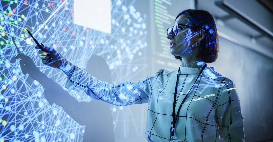 young teacher using AI to teach in the classroom