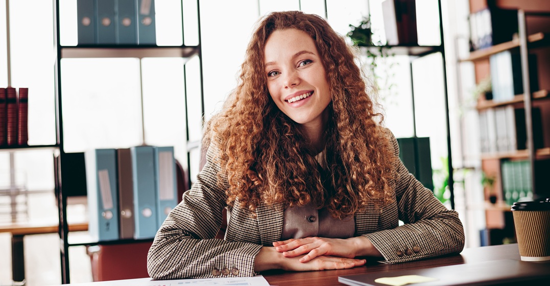 Confident young woman getting hired in a job interview