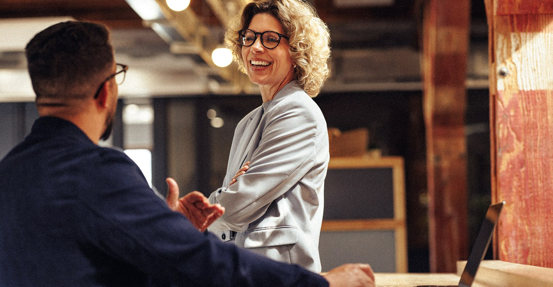 Two professionals talking to each other and saying 