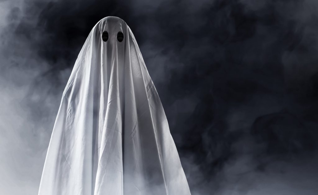 halloween fancy dress costumes as a ghost with a sheet over head