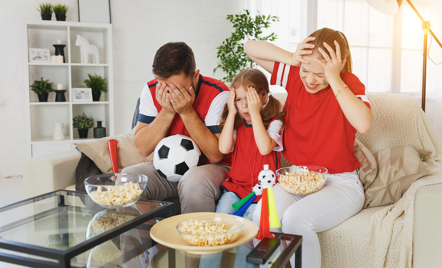 French family watching the football