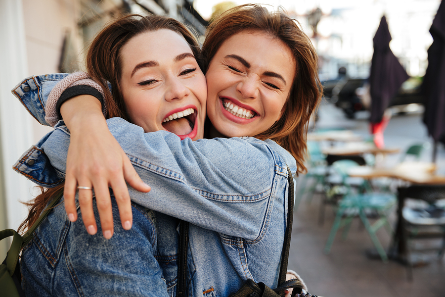 French friends smiling together and laughing